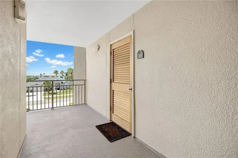 a view of a room with a floor to ceiling window