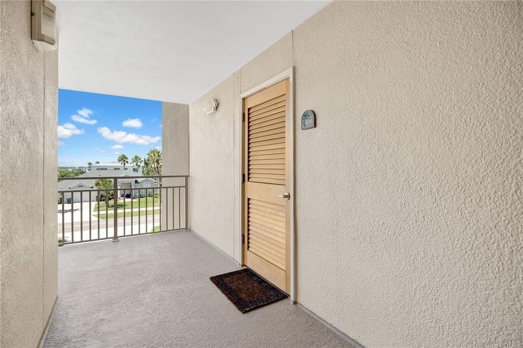 4505 South Atlantic Avenue, Unit 305 Ponce Inlet, FL 32127 - Photo 3 of 34 a view of a room with a floor to ceiling window