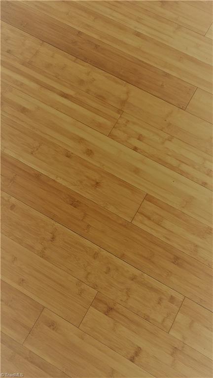 943 Neely Road Asheboro, NC 27205 - Photo 11 of 15 Bamboo Floors in Living Room, Kitchen, Dining Area and Hall.
