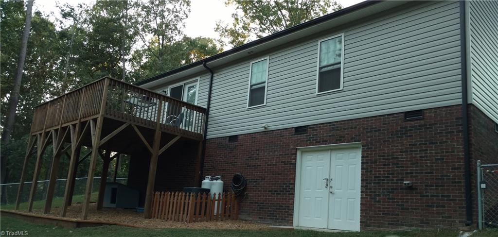 943 Neely Road Asheboro, NC 27205 - Photo 12 of 15 Back Exterior w/ Deck,Fencing and Lrg Crawlspace.