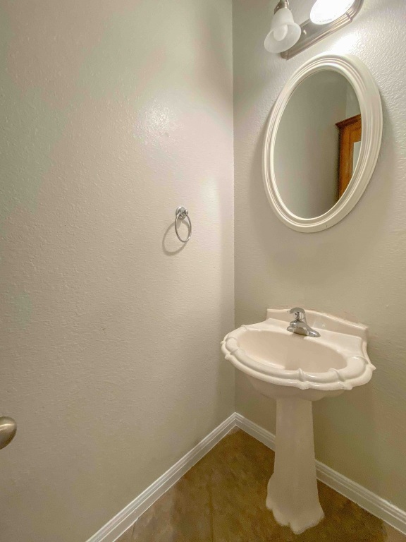 609 West 37th Street Austin, TX 78705 - Photo 12 of 38 a bathroom with a sink and a mirror
