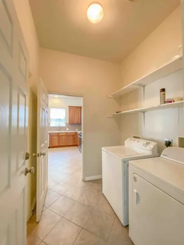 a large bathroom with a double vanity sink and a large mirror