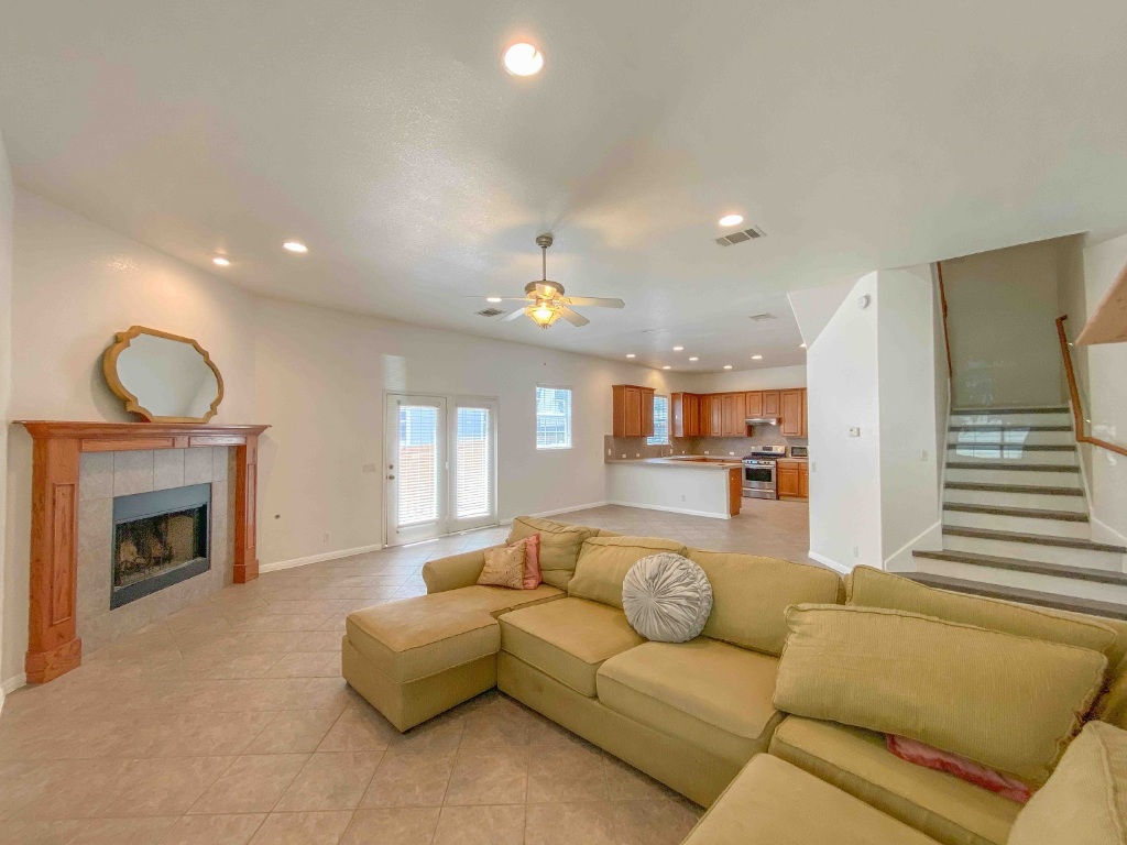 609 West 37th Street Austin, TX 78705 - Photo 2 of 38 a living room with furniture a fireplace and a chandelier