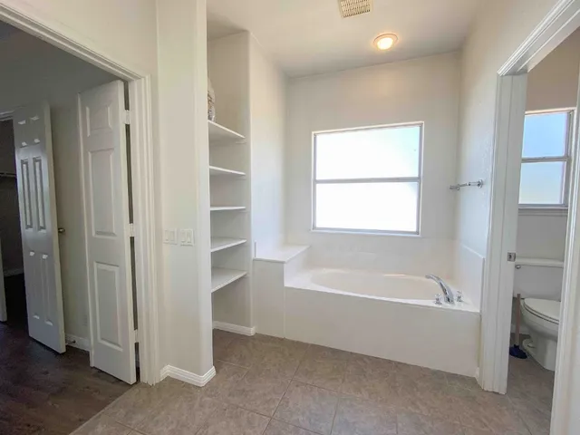 a view of an empty walk in closet