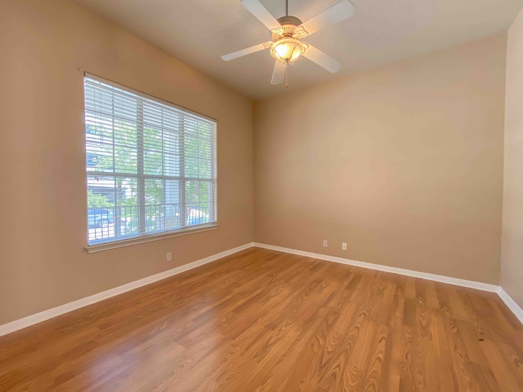 609 West 37th Street Austin, TX 78705 - Photo 10 of 38 wooden floor in an empty room with a window