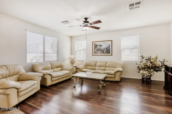 a bathroom with a granite countertop sink toilet a shower and a mirror