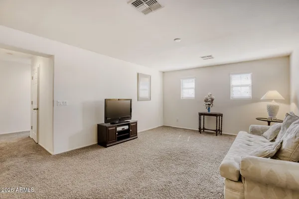 a view of a walk in closet with clothes