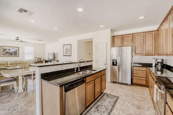 a kitchen with a table and chairs in it