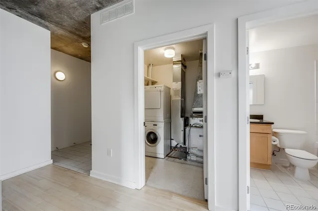 a white bath tub sitting next to a white toilet