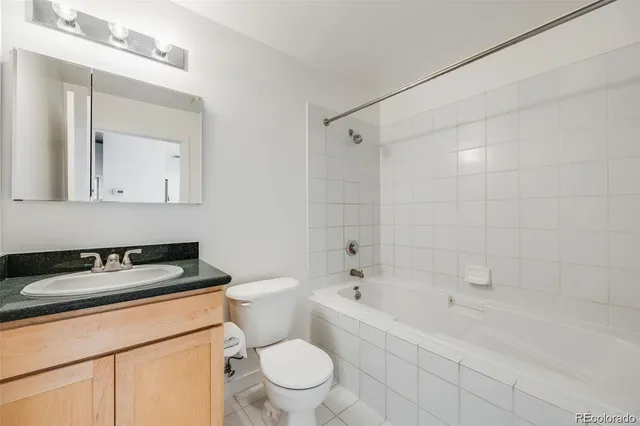 a kitchen with stainless steel appliances a refrigerator and a stove