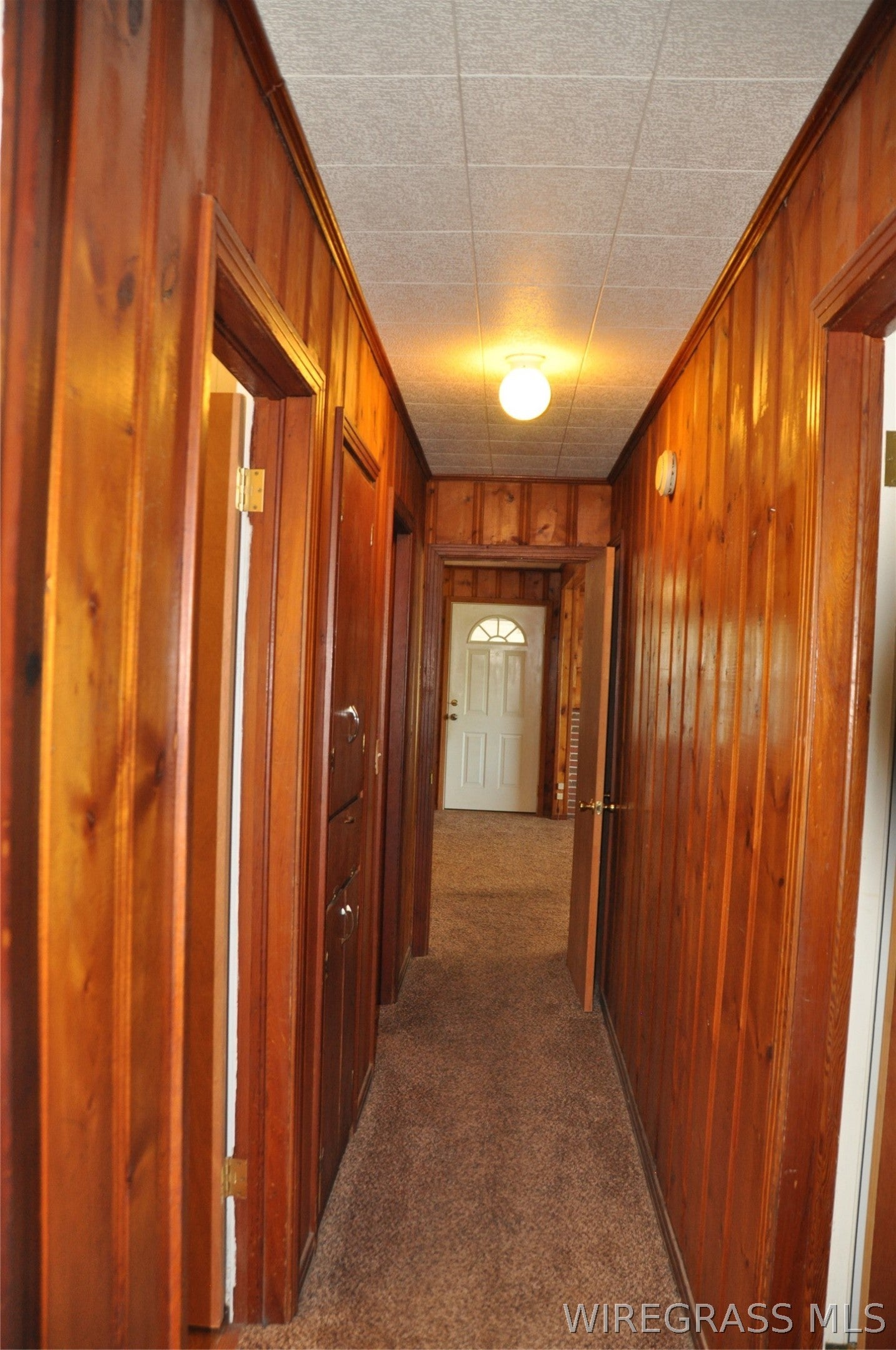 910 Holley Mill Road Samson, AL 36477 - Photo 21 of 61 Looking from bedroom 2 back toward the living room. First door on the left is the . . .