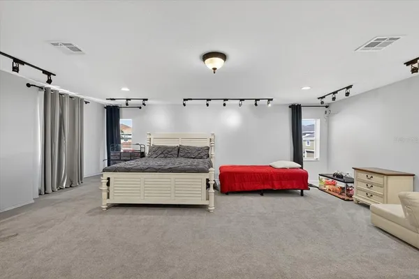 an aerial view of multiple houses with yard