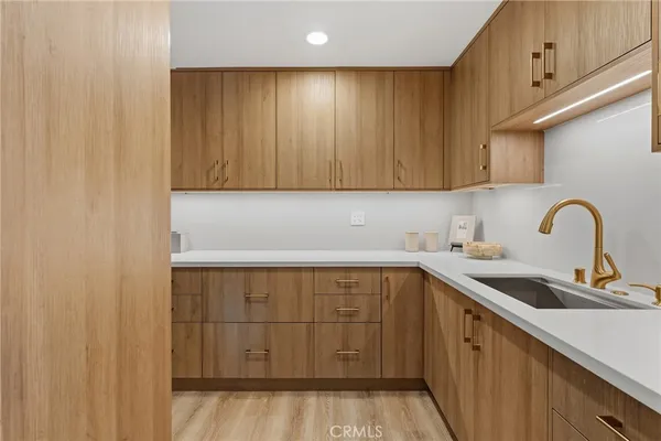 a kitchen with a sink and cabinets