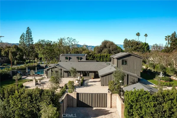 a aerial view of a house with a big yard