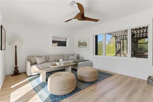 a living room with furniture and a window
