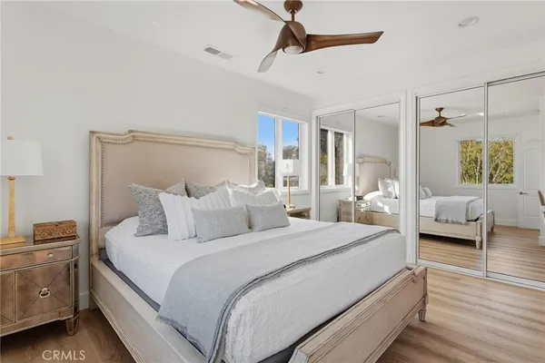 a bedroom with bed and window