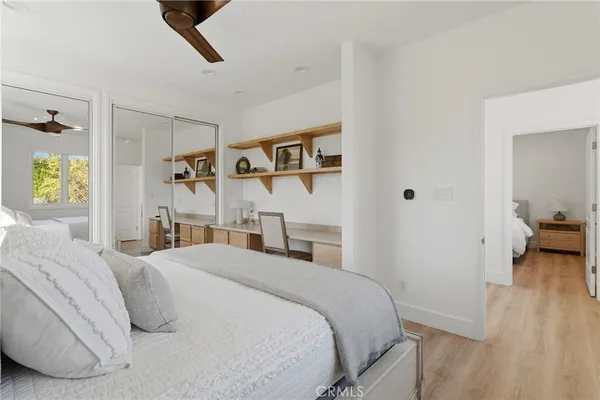 a bedroom with a bed and a walk in closet