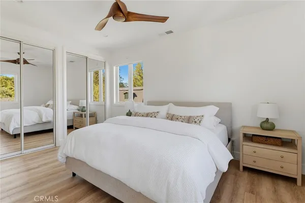 a bedroom with a bed and a view of bedroom