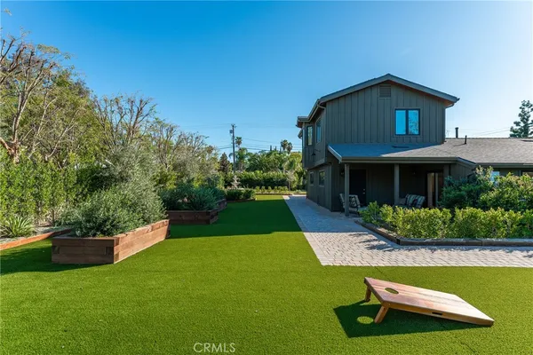 a view of a yard with an outdoor seating