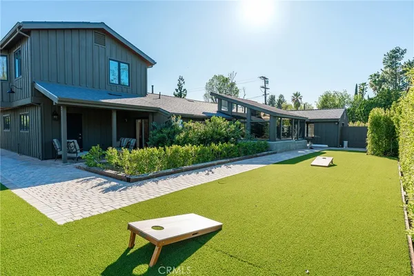 a view of an entrance to house with yard