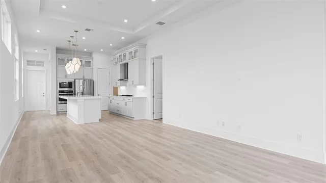 a view of kitchen with wooden floor