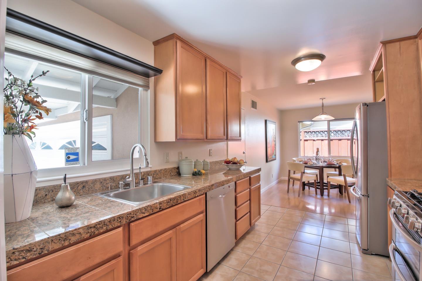 2221 Sutter Avenue Santa Clara, CA 95050 - Photo 11 of 29 a bathroom with a sink and a mirror