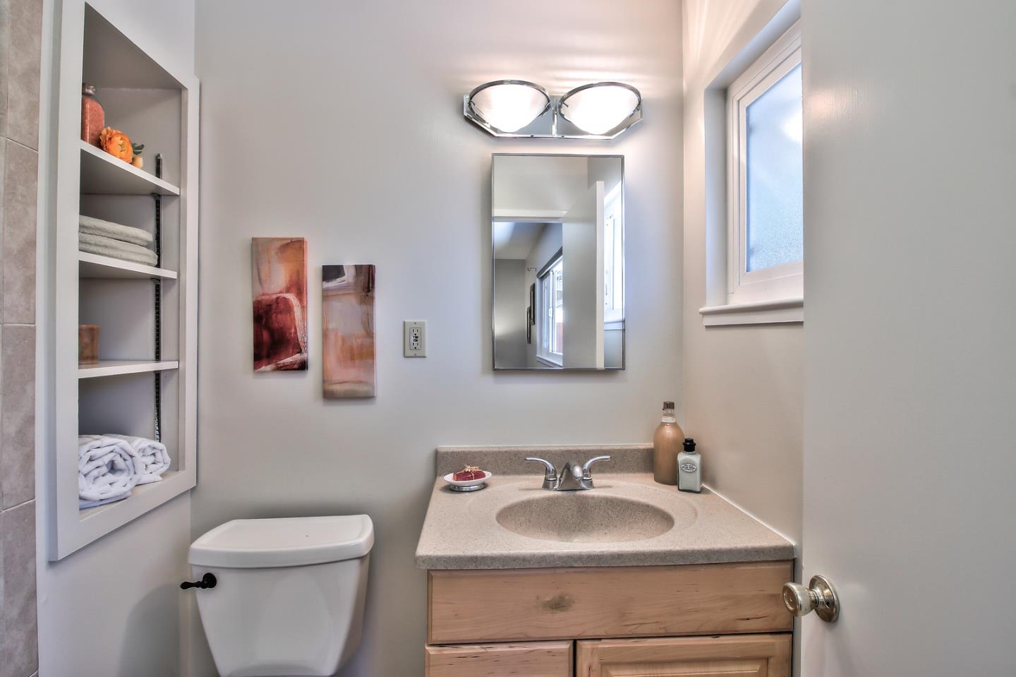 2221 Sutter Avenue Santa Clara, CA 95050 - Photo 18 of 29 a bathroom with a toilet sink and mirror