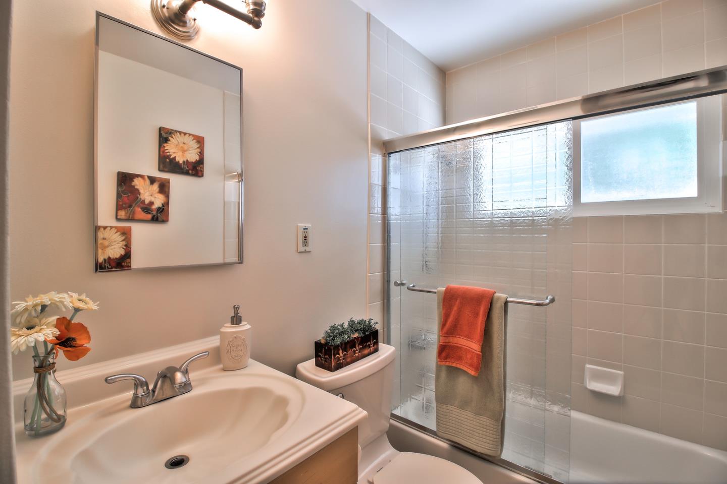 2221 Sutter Avenue Santa Clara, CA 95050 - Photo 19 of 29 a bathroom with a sink and a mirror
