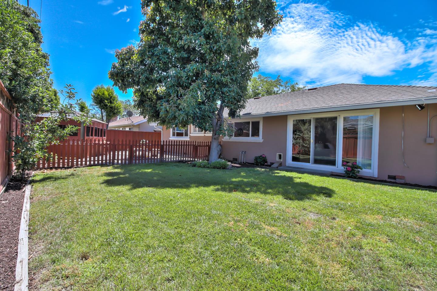 2221 Sutter Avenue Santa Clara, CA 95050 - Photo 21 of 29 a view of house with backyard porch and entertaining space