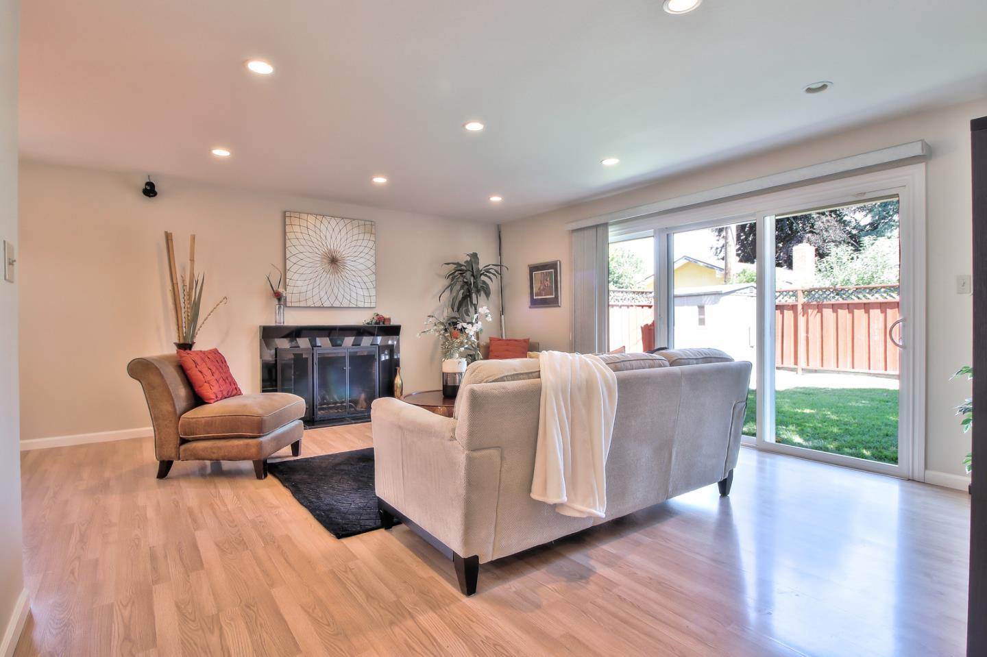 2221 Sutter Avenue Santa Clara, CA 95050 - Photo 5 of 29 a living room with furniture and a fireplace