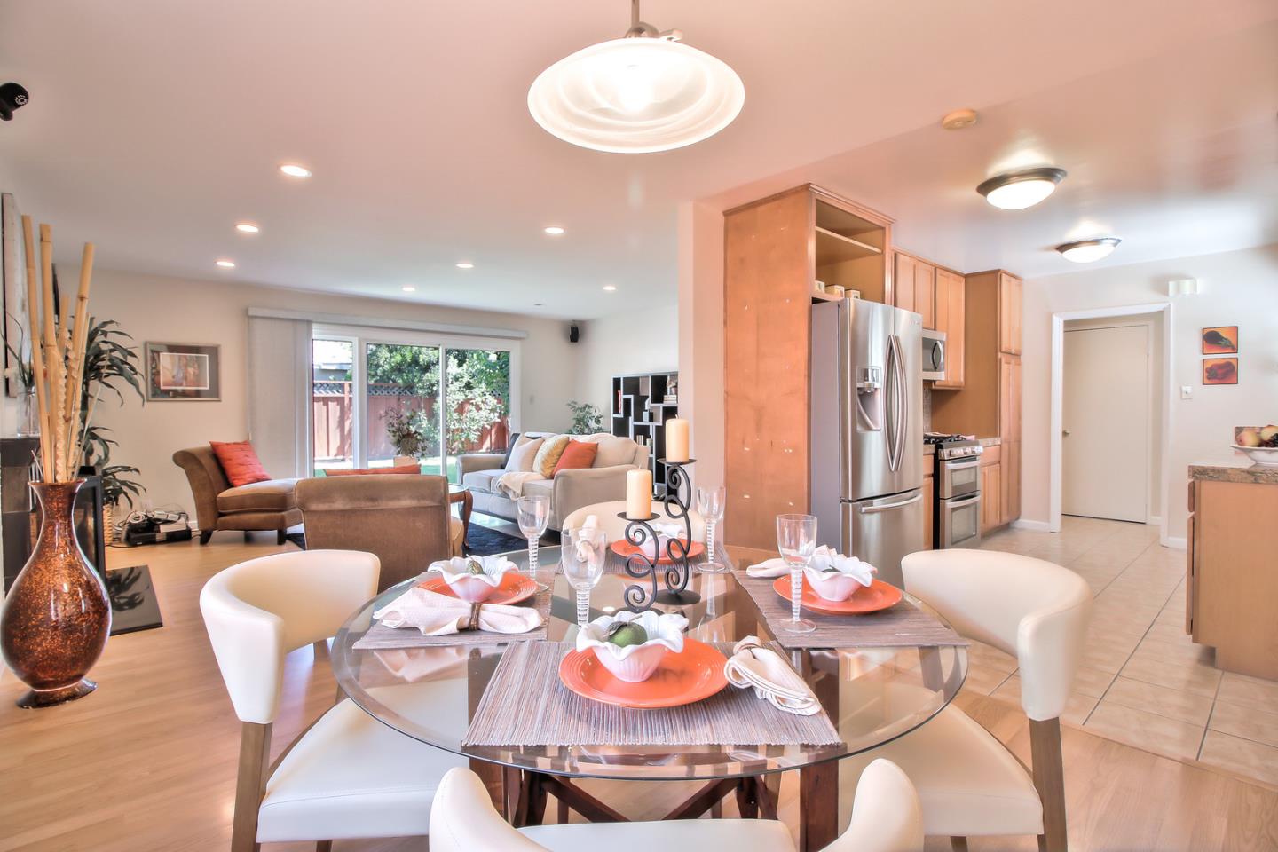 2221 Sutter Avenue Santa Clara, CA 95050 - Photo 9 of 29 a living room with furniture kitchen and a chandelier