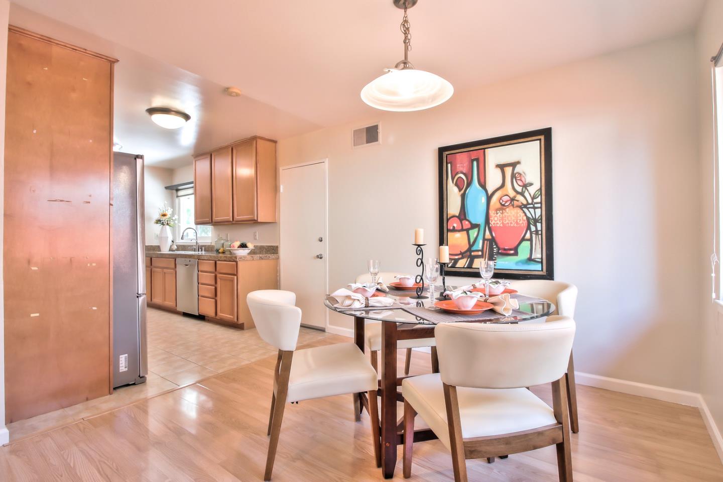 2221 Sutter Avenue Santa Clara, CA 95050 - Photo 10 of 29 a dining room with furniture and wooden floor
