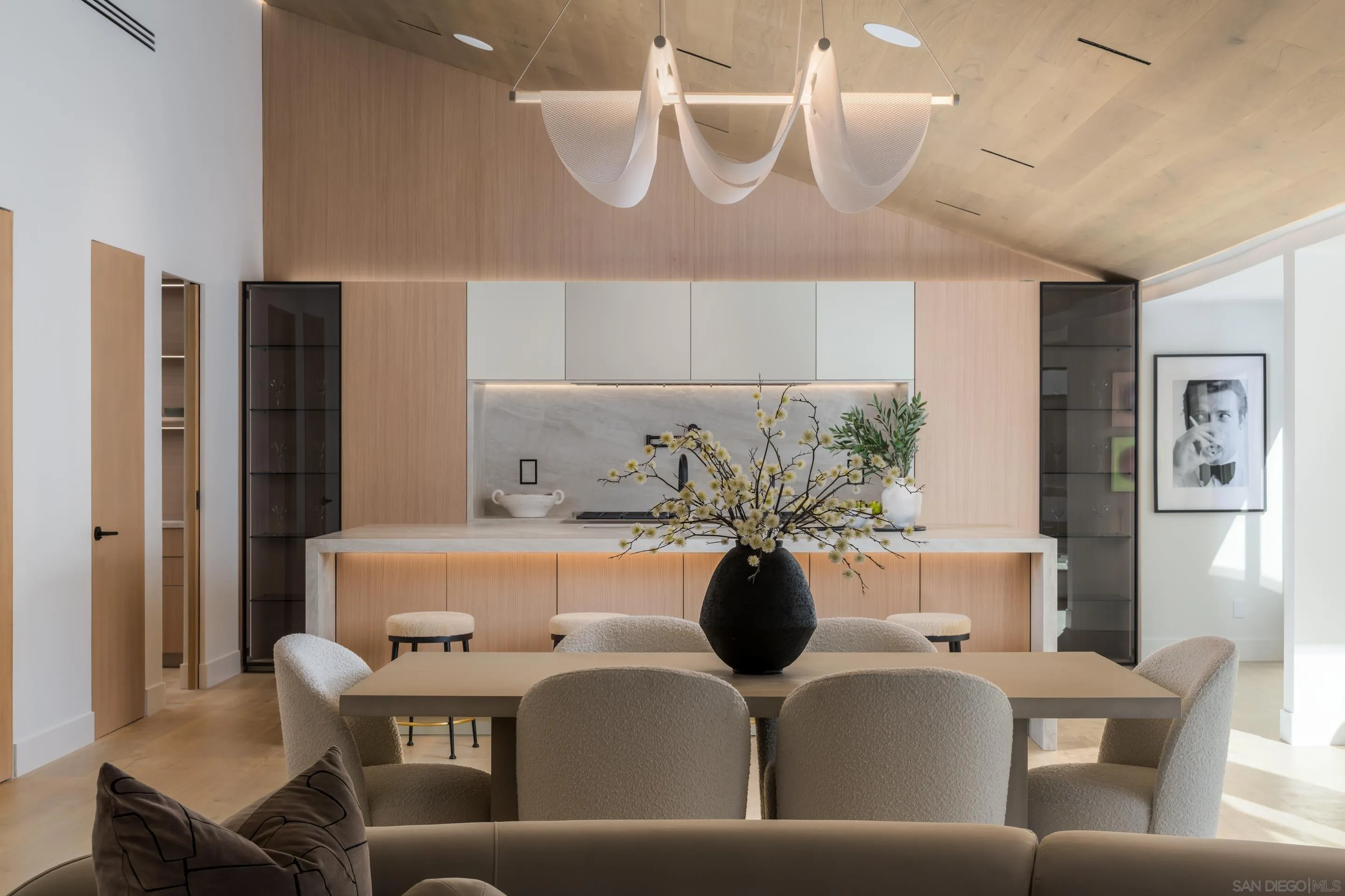 5826 Soledad Mountain Road La Jolla, CA 92037 - Photo 15 of 52 a view of a dining room with furniture and chandelier