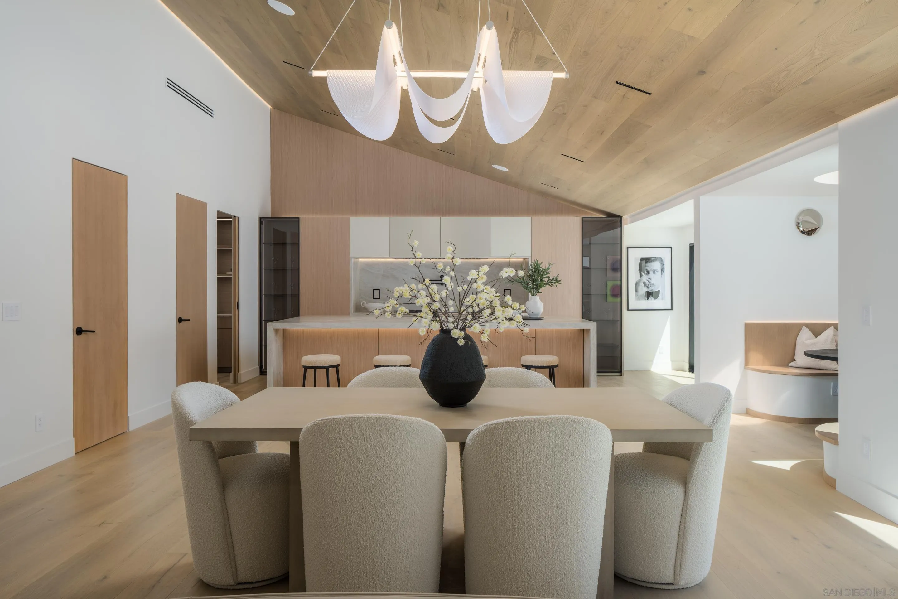 5826 Soledad Mountain Road La Jolla, CA 92037 - Photo 16 of 52 a dining room with furniture and wooden floor