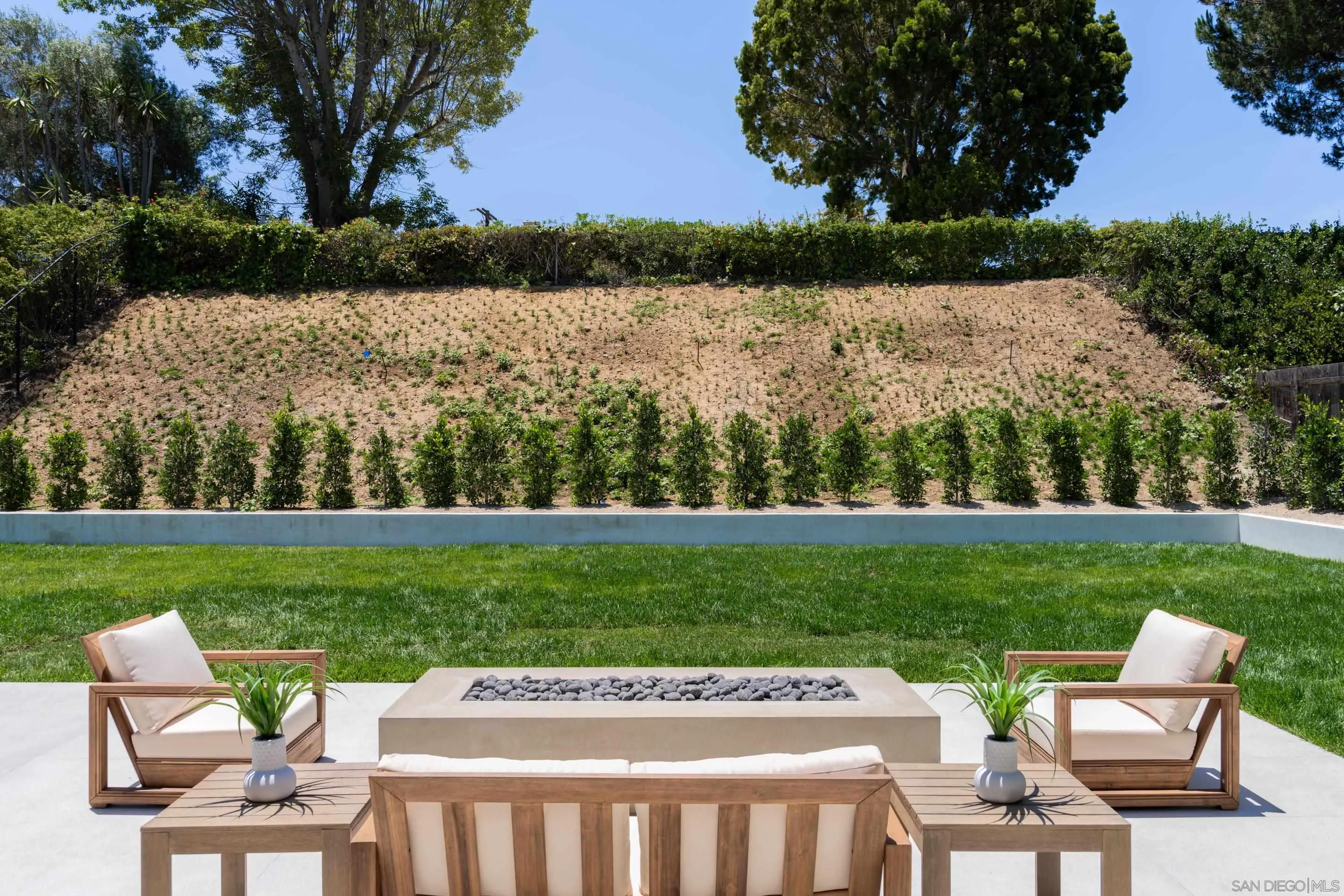 5826 Soledad Mountain Road La Jolla, CA 92037 - Photo 35 of 52 a view of a table and chairs in the yard