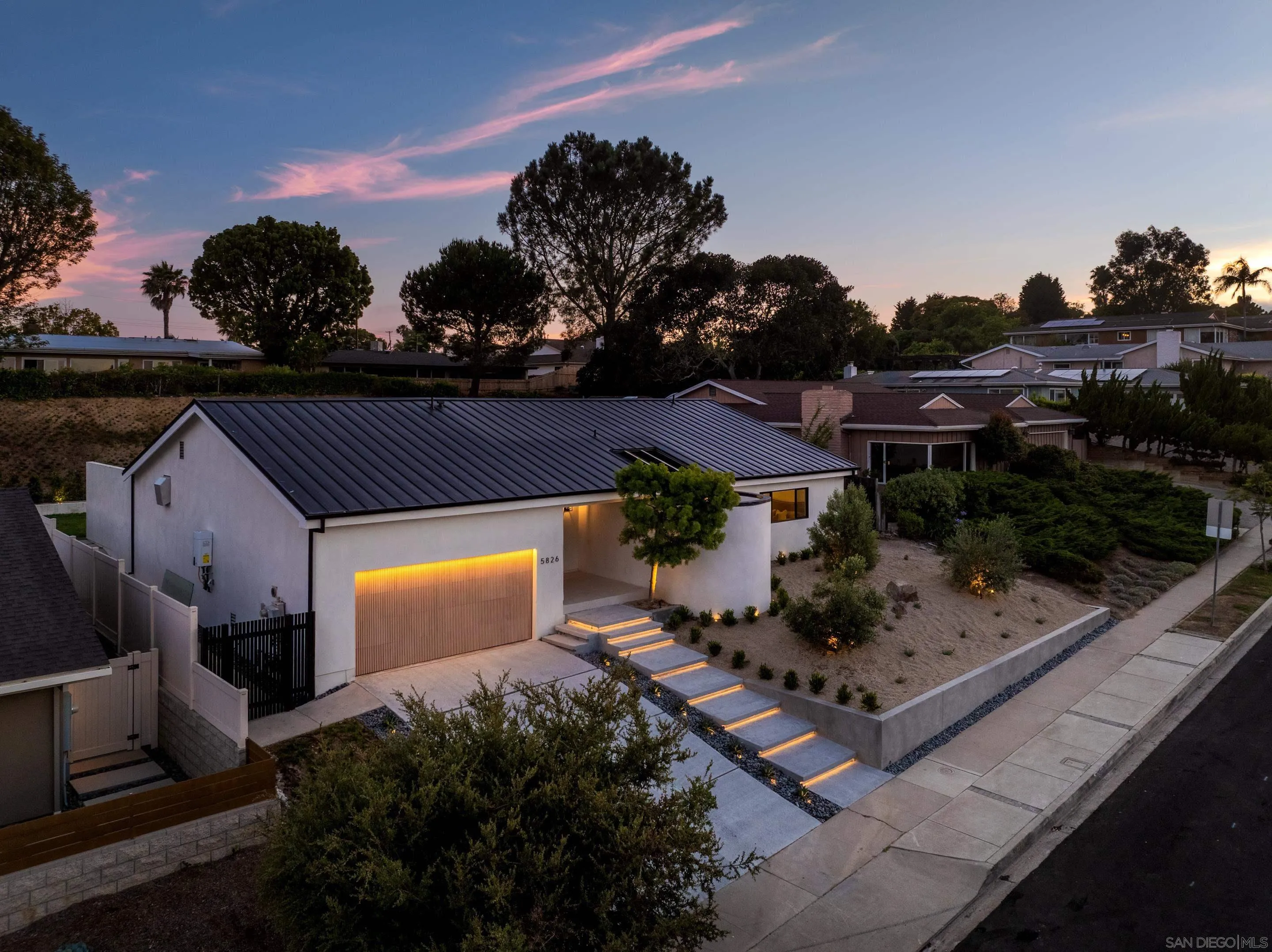 5826 Soledad Mountain Road La Jolla, CA 92037 - Photo 39 of 52 a front view of a house with a yard
