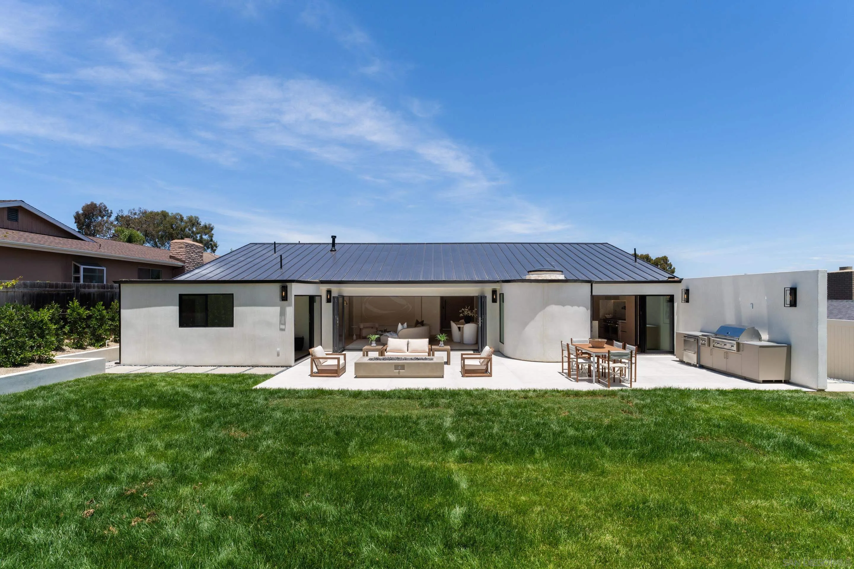 5826 Soledad Mountain Road La Jolla, CA 92037 - Photo 40 of 52 a front view of house with yard and seating area