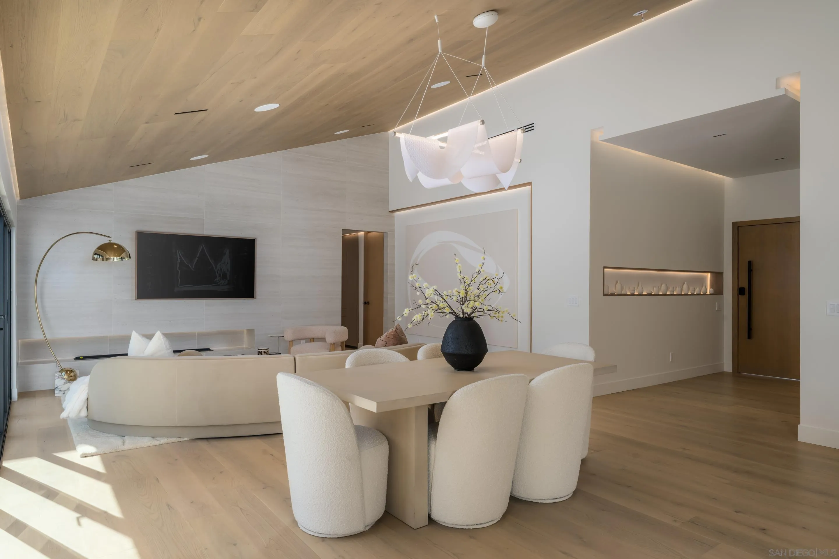 5826 Soledad Mountain Road La Jolla, CA 92037 - Photo 4 of 52 a living room with furniture and a flat screen tv