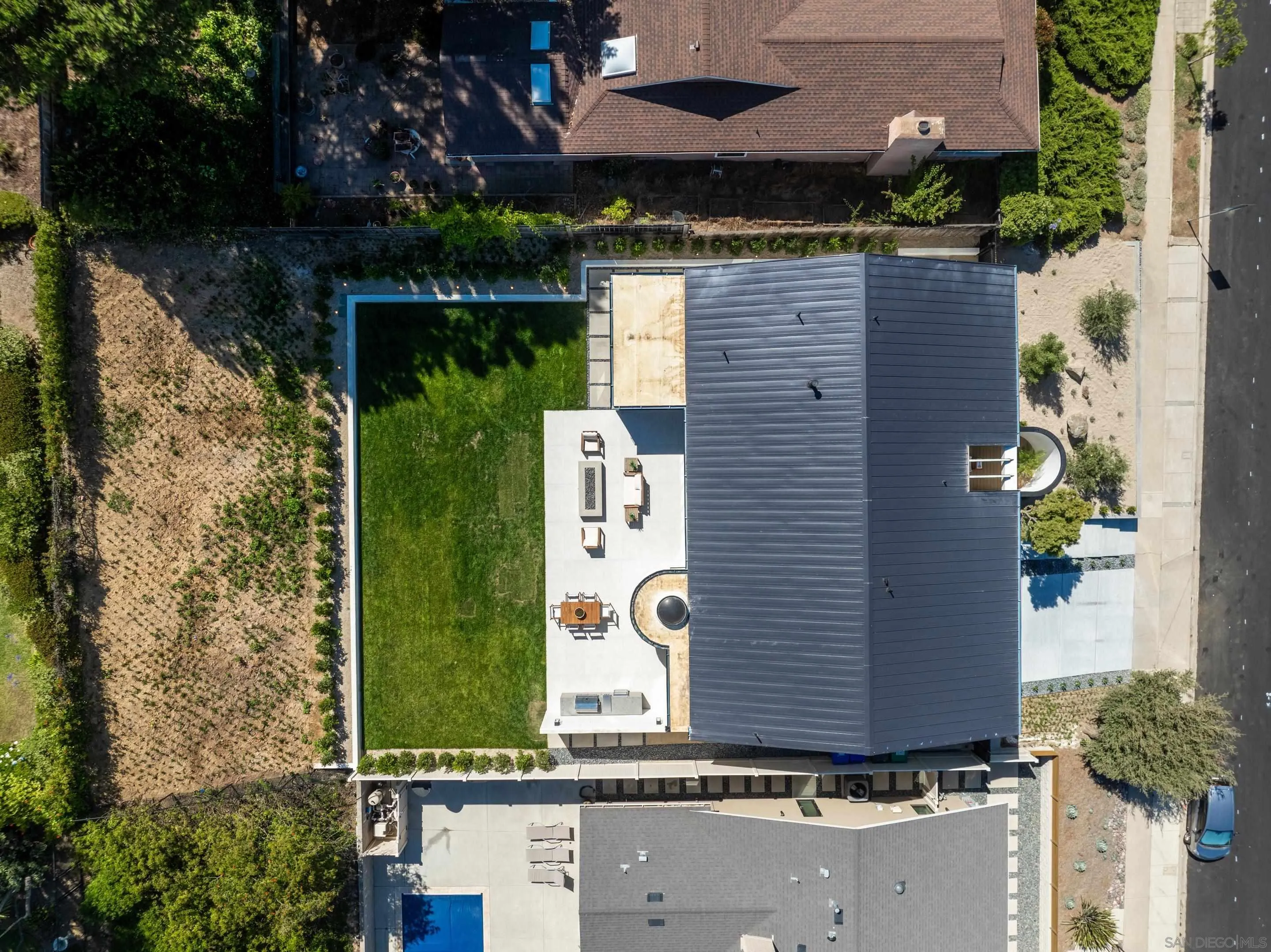 5826 Soledad Mountain Road La Jolla, CA 92037 - Photo 45 of 52 an aerial view of a house with a yard and a large tree