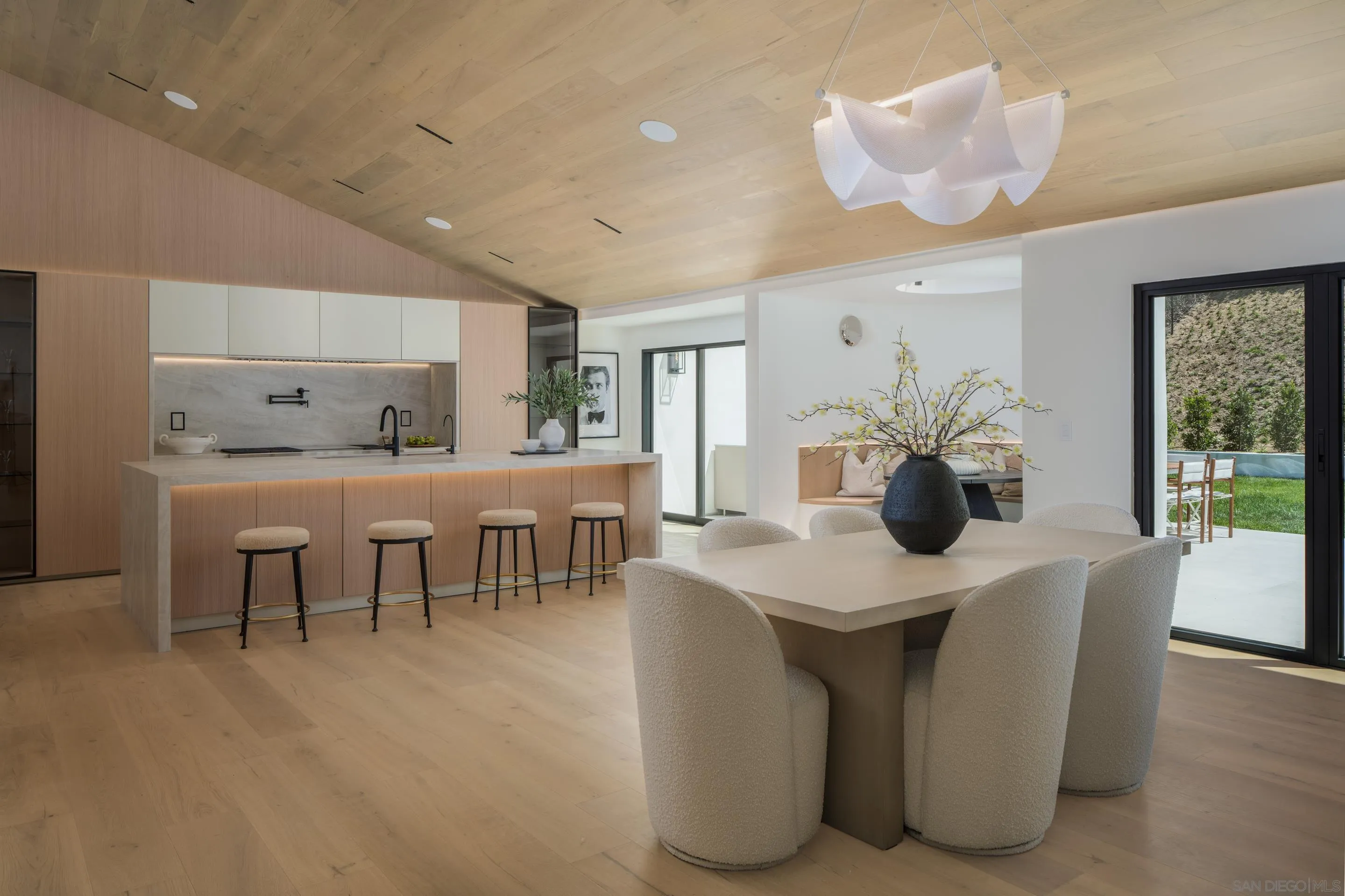 5826 Soledad Mountain Road La Jolla, CA 92037 - Photo 6 of 52 a view of dining table and chairs