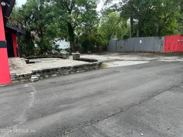 a view of street with residential houses
