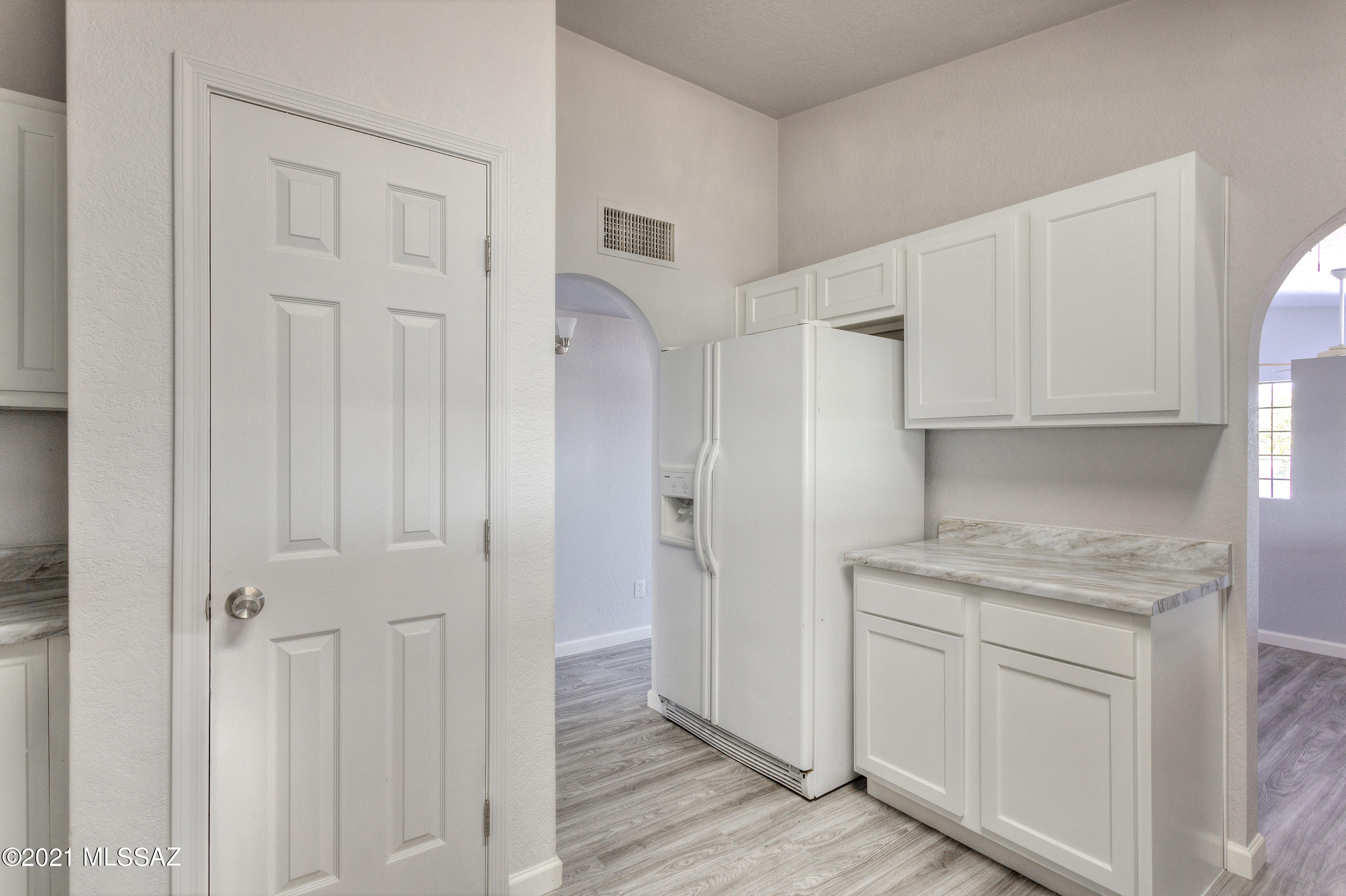 1096 Montosa Circulo Rio Rico, AZ 85648 - Photo 15 of 39 a view of a kitchen with white cabinets