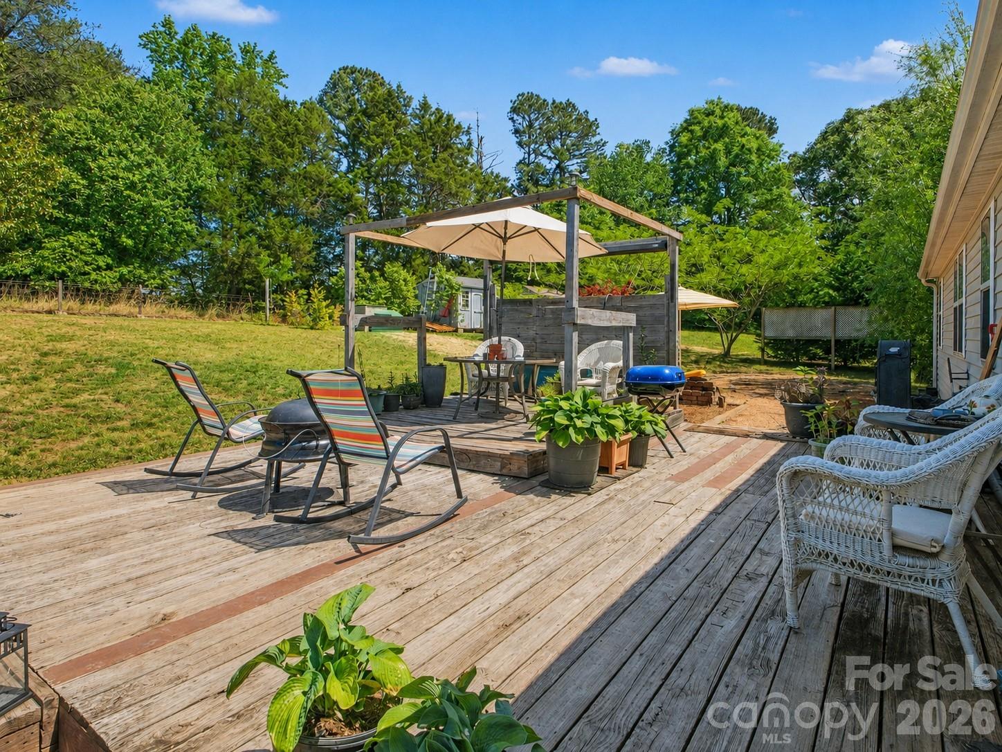 539 Brawley Road Cleveland, NC 27013 - Photo 27 of 41 an outdoor space with furniture and umbrella