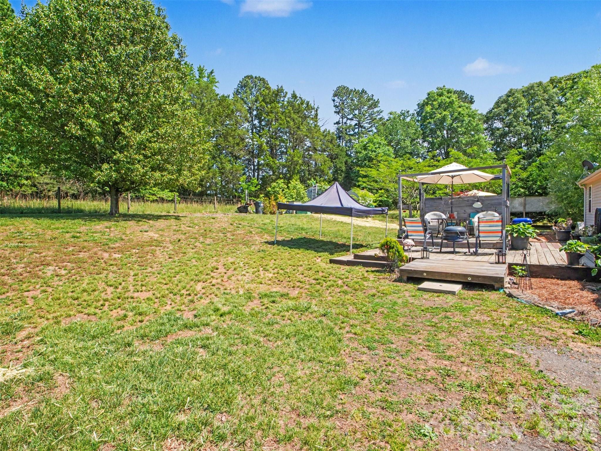 539 Brawley Road Cleveland, NC 27013 - Photo 33 of 41 a view of a swimming pool with a patio and a yard
