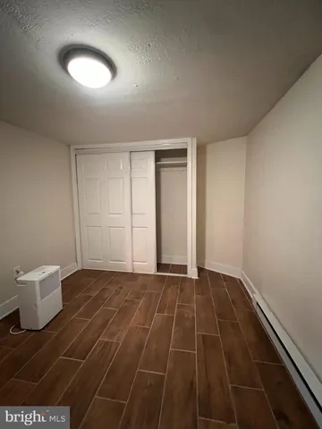 a view of an empty room and a window