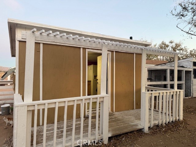 16100 Navajo Road Apple Valley, CA 92307 - Photo 22 of 55 a view of a house with a porch