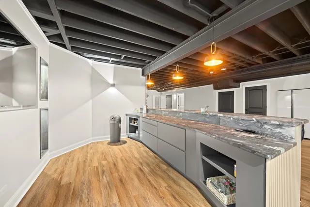 a kitchen with stainless steel appliances granite countertop a sink and cabinets