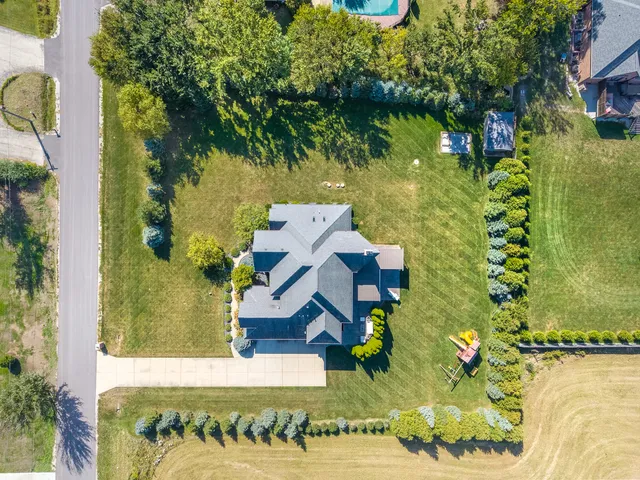 an aerial view of residential houses with outdoor space