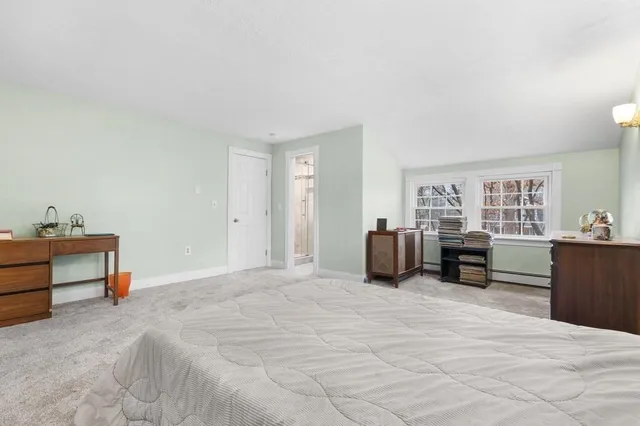a bedroom with furniture and window