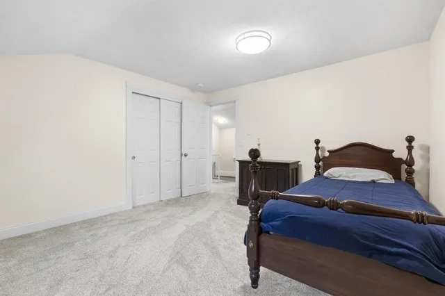 a bedroom with a bed and a cabinets